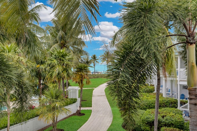 view of home's community featuring a lawn