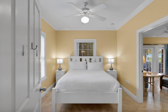 bedroom with crown molding, multiple windows, and light tile patterned floors