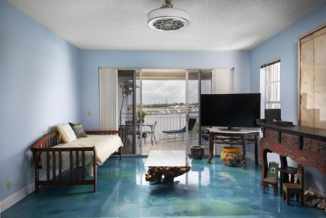 living room with concrete flooring and a textured ceiling