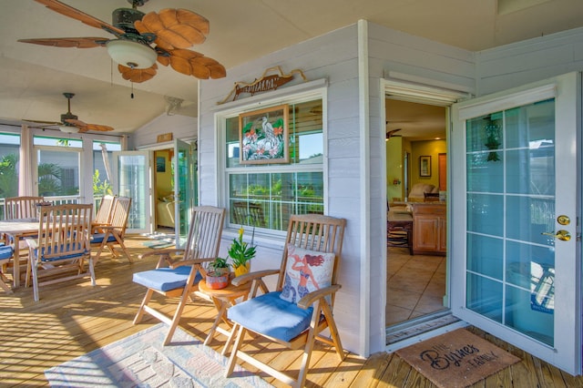 interior space featuring lofted ceiling and ceiling fan