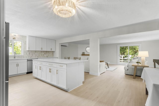 82260 Overseas Hwy, Islamorada, FL 33036 - kitchen with dishwasher, open floor plan, light countertops, and light wood-type flooring