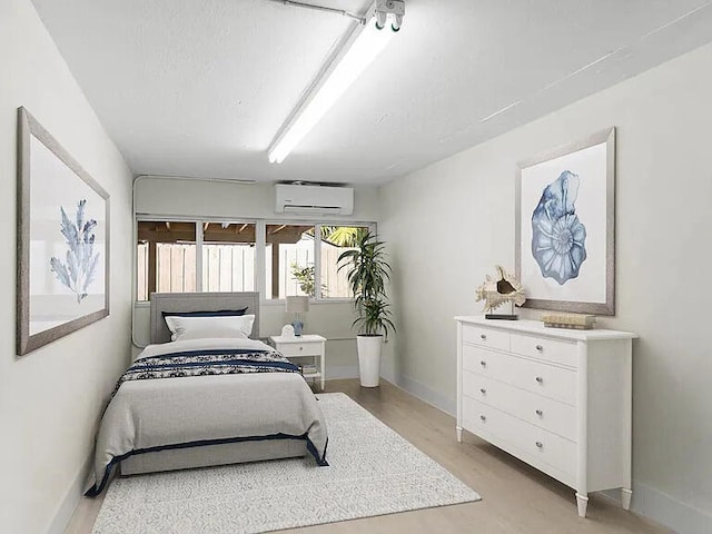 82260 Overseas Hwy, Islamorada, FL 33036 - bedroom featuring a wall mounted air conditioner and baseboards