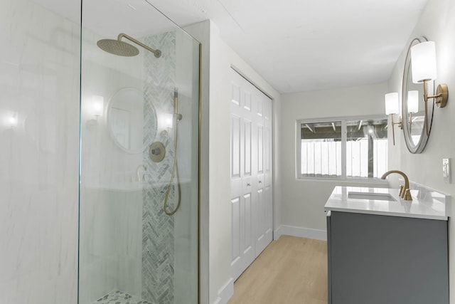 82260 Overseas Hwy, Islamorada, FL 33036 - bathroom with a shower stall, wood finished floors, vanity, and baseboards
