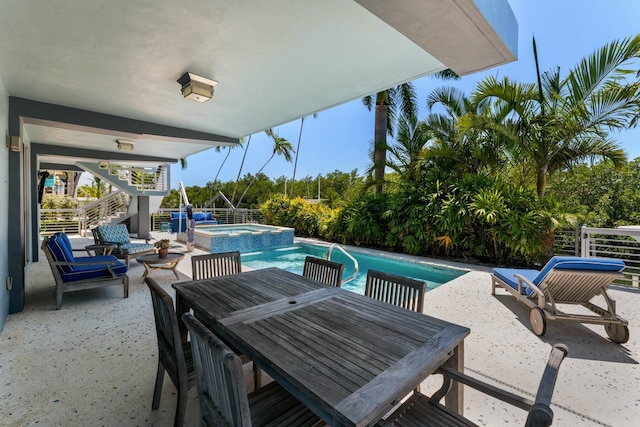 view of patio with stairway, outdoor dining space, and a pool with connected hot tub