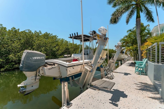 view of dock featuring a water view and boat lift