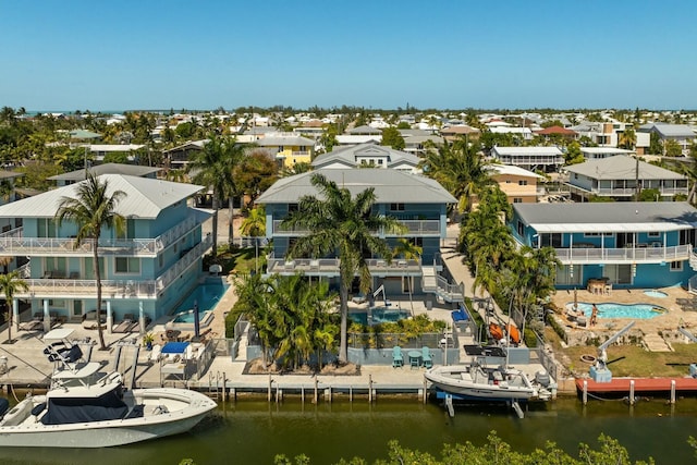aerial view with a residential view and a water view
