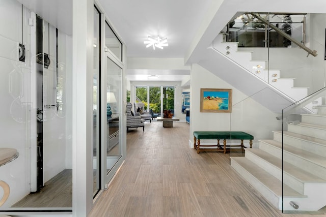 entrance foyer with stairway and wood finished floors