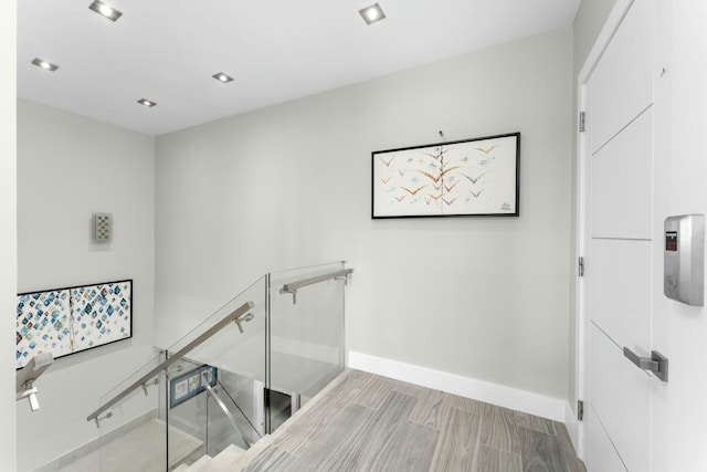 stairs featuring recessed lighting and baseboards