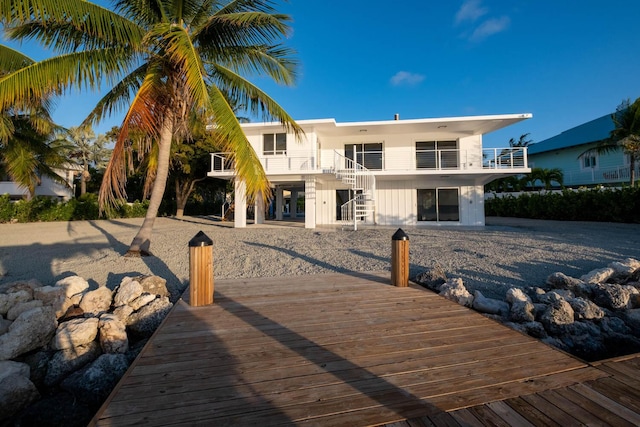 dock area with a balcony and stairs