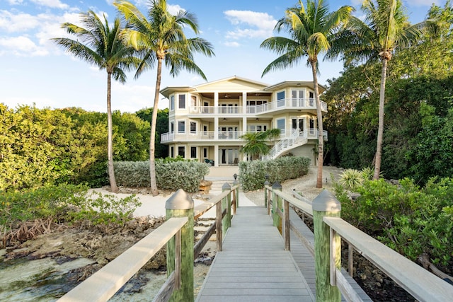 back of property with a balcony