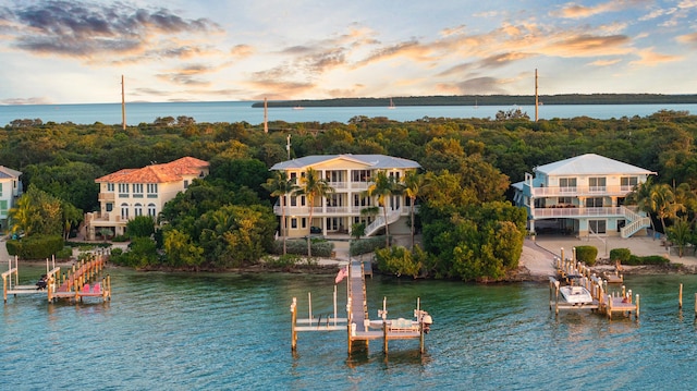 aerial view at dusk with a water view