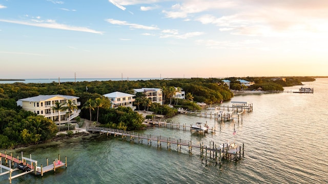 aerial view at dusk with a water view