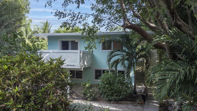 view of side of home with a balcony