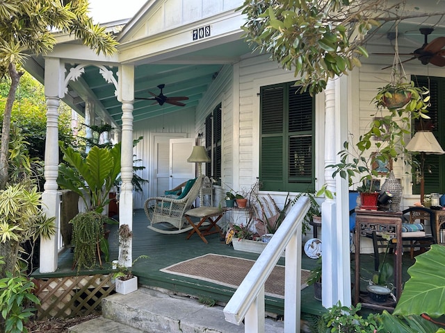 wooden deck with ceiling fan and a porch