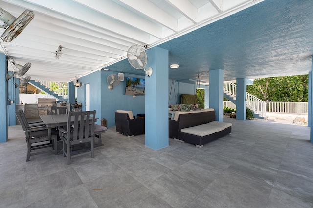 view of patio with an outdoor hangout area and exterior kitchen