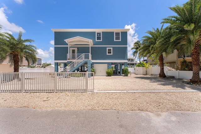 view of front of property with a porch and a garage