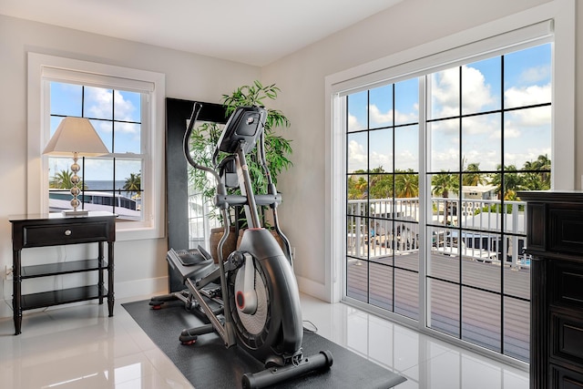 workout area with light tile patterned flooring