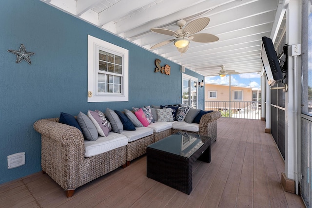 deck with ceiling fan and an outdoor hangout area