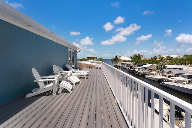 wooden terrace with a water view