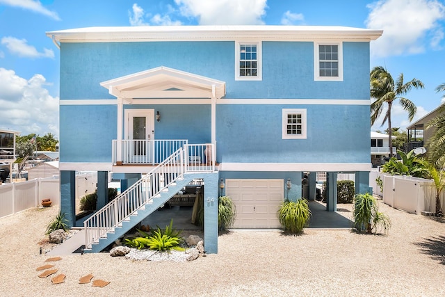 view of front of home with a garage and covered porch