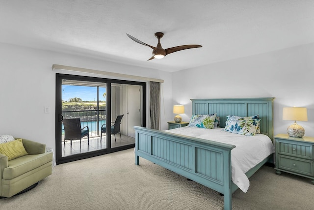 bedroom with access to outside, a ceiling fan, and carpet flooring