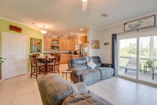 480 E 105th Street Ocean St, Marathon, FL 33050 - living room featuring light tile patterned floors, visible vents, ceiling fan, and ornamental molding
