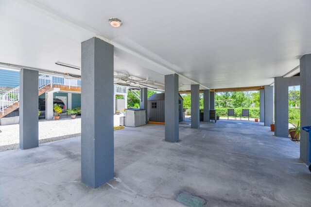 480 E 105th Street Ocean St, Marathon, FL 33050 - view of patio with an outbuilding, a storage shed, and stairs