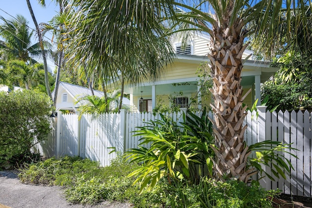 view of home's exterior with fence