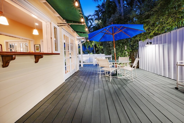 wooden deck featuring outdoor dining space