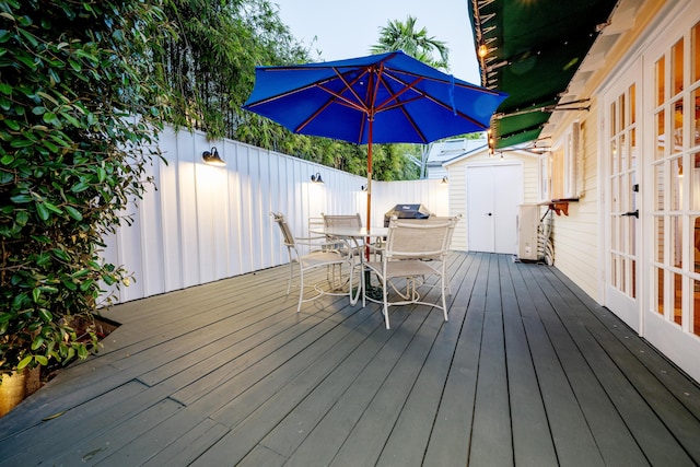 wooden deck featuring fence and outdoor dining space