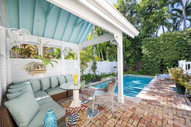 view of swimming pool featuring a patio area, a fenced backyard, an outdoor living space, and a fenced in pool