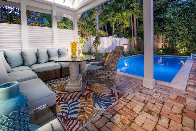 view of pool featuring a fenced in pool, a fenced backyard, a patio, and an outdoor hangout area