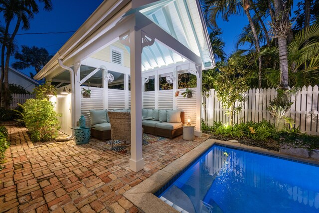 view of pool featuring a fenced in pool, a patio, an outdoor hangout area, fence, and a gazebo