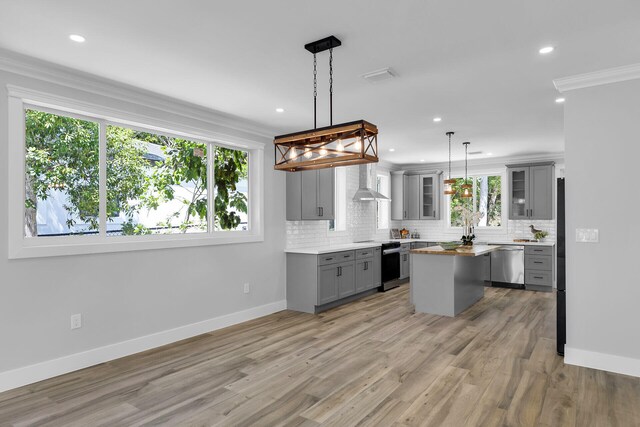 68 Coral Way, Key Largo, FL 33037 - kitchen featuring freestanding refrigerator, wooden counters, gray cabinetry, wine cooler, and ornamental molding