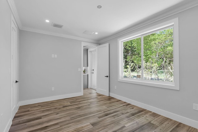 68 Coral Way, Key Largo, FL 33037 - spare room with crown molding, wood finished floors, and recessed lighting