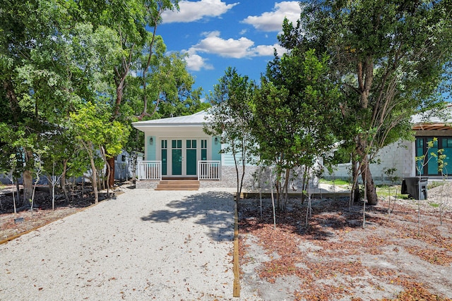 68 Coral Way, Key Largo, FL 33037 - view of front of property with covered porch and a metal roof