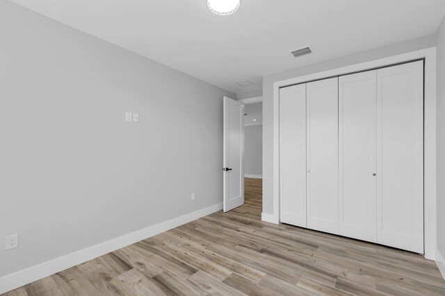 68 Coral Way, Key Largo, FL 33037 - bedroom with light wood-style flooring