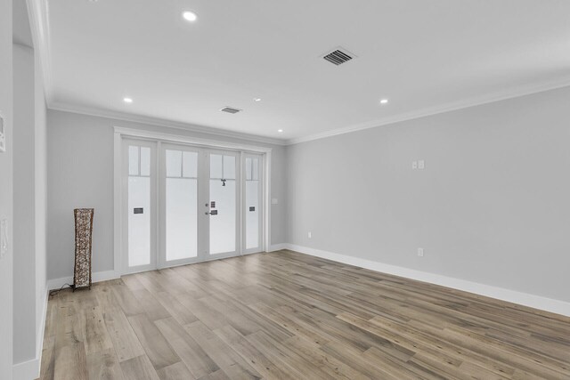 68 Coral Way, Key Largo, FL 33037 - unfurnished room with ornamental molding, wood finished floors, recessed lighting, and a smoke detector