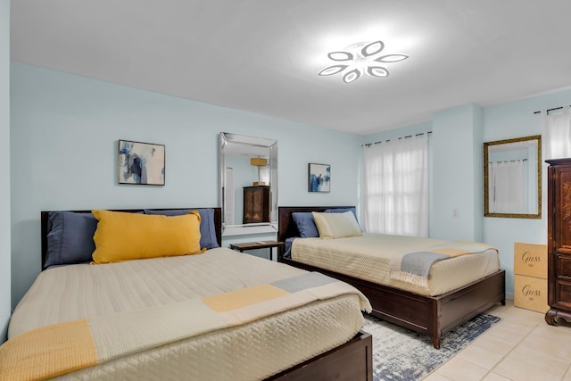 bedroom featuring light tile patterned flooring