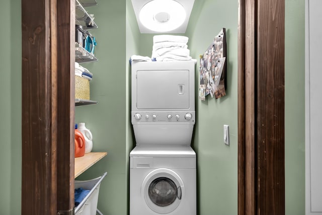 laundry area featuring stacked washer and clothes dryer