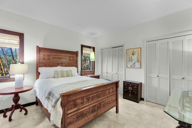 bedroom featuring multiple closets