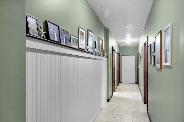 corridor featuring light tile patterned flooring