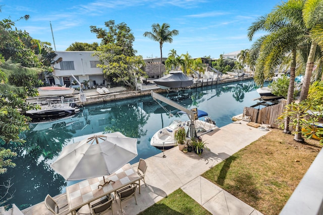 view of pool featuring a lawn and a boat dock