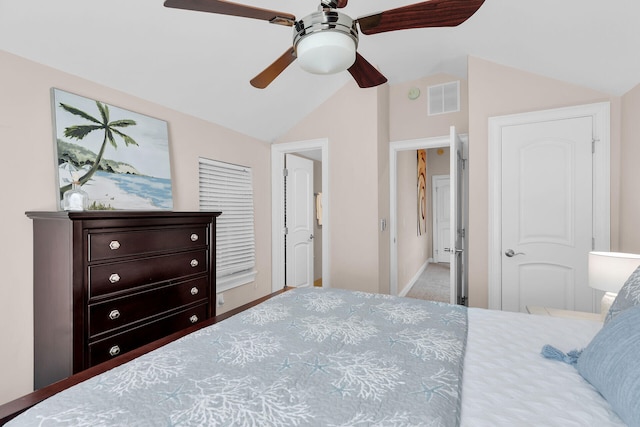 bedroom featuring lofted ceiling, baseboards, carpet flooring, and a ceiling fan