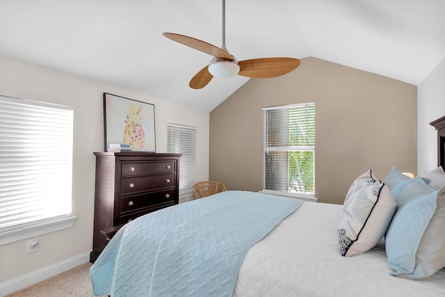 bedroom featuring lofted ceiling, baseboards, and ceiling fan