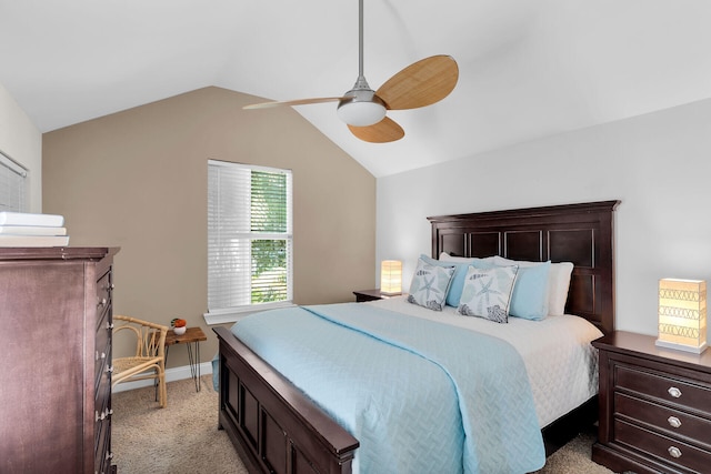 bedroom featuring light carpet, vaulted ceiling, a ceiling fan, and baseboards