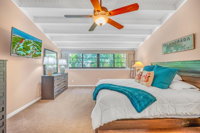 carpeted bedroom featuring lofted ceiling with beams and ceiling fan