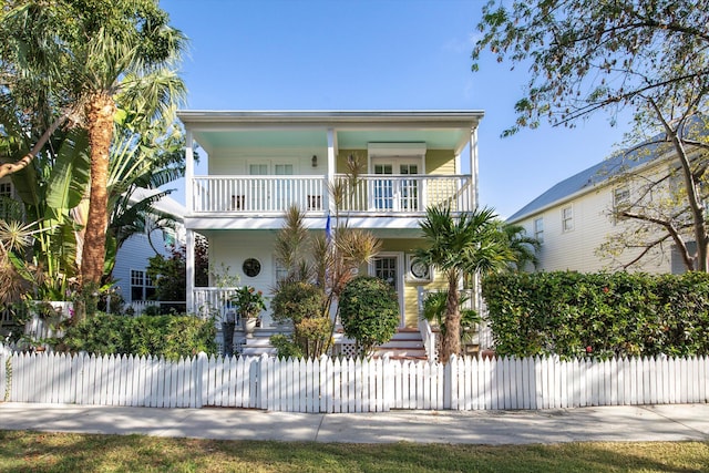 coastal home featuring a balcony