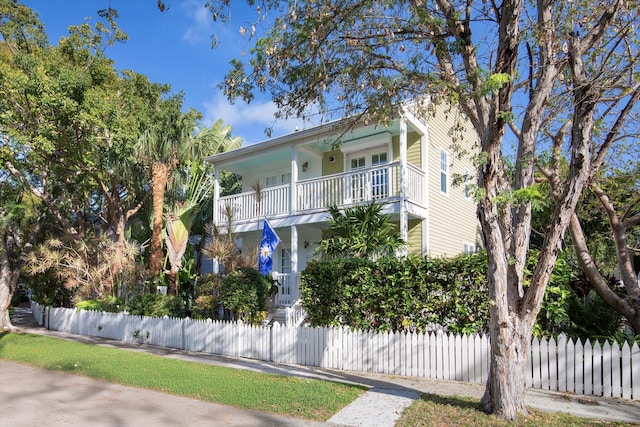 view of front of house featuring a balcony