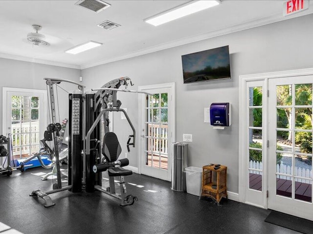 workout area featuring ornamental molding